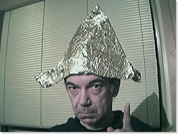 A stereotypical 'conspiracy theorist' with tinfoil hat