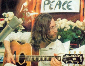 John Lennon in bed.jpg