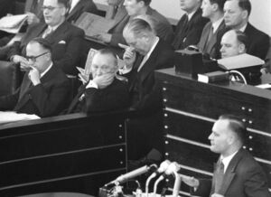 Walter Hallstein sitting with Konrad Adenauer in the Bundestag; Karl Mommer speaking