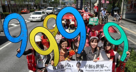 Women stage a street protest ahead of a Cabinet decision authorizing national security bills, in Tokyo's Ginza district, on May 14, 2015.